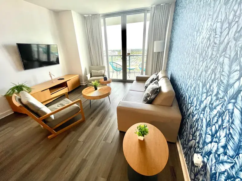 Living room with balcony access at Beachwalk